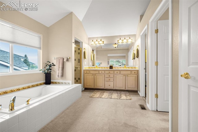 12265 Jones Park Ct, Colorado Springs, CO 80921 - full bathroom featuring double vanity, a shower stall, and a bath