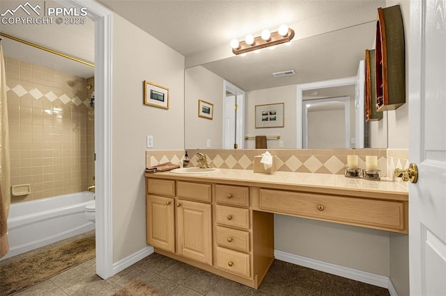 12265 Jones Park Ct, Colorado Springs, CO 80921 - bathroom with vanity, tile patterned floors, tasteful backsplash, toilet, and bathing tub / shower combination