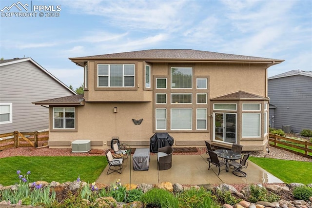 12265 Jones Park Ct, Colorado Springs, CO 80921 - rear view of house featuring a patio and stucco siding