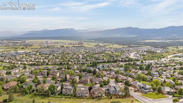 12265 Jones Park Ct, Colorado Springs, CO 80921 - aerial view of property's location with a mountainous background and nearby suburban area