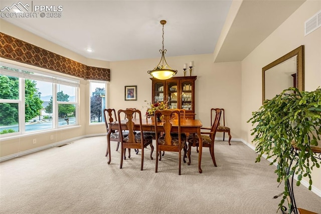 12265 Jones Park Ct, Colorado Springs, CO 80921 - dining room featuring light colored carpet and baseboards