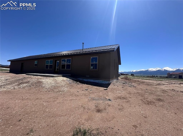 55 Kryptonite Ct, Westcliffe, CO 81252 - rear view of property featuring a mountain view and metal roof
