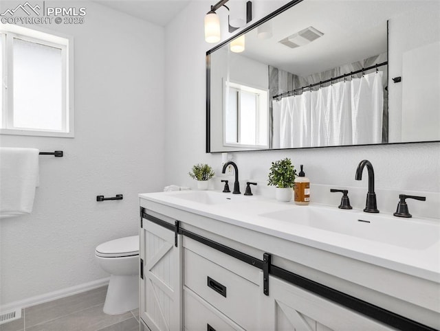 1159 N Linda Ln, Pueblo West, CO 81007 - full bath with toilet, double vanity, baseboards, and curtained shower