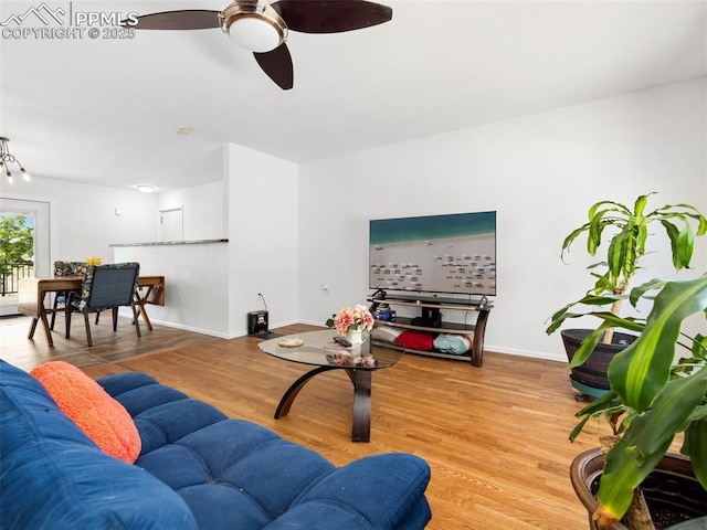 1159 N Linda Ln, Pueblo West, CO 81007 - living room with a ceiling fan, wood finished floors, and baseboards