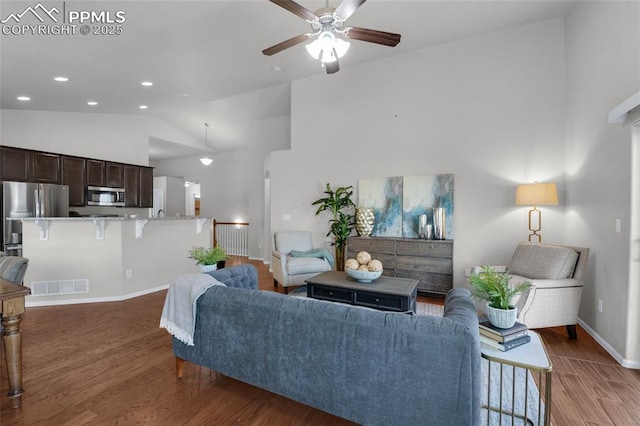 8795 Canary Cir, Colorado Springs, CO 80908 - living room with high vaulted ceiling, wood finished floors, a ceiling fan, baseboards, and recessed lighting