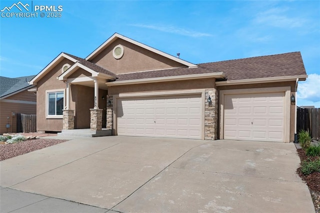 8795 Canary Cir, Colorado Springs, CO 80908 - view of front facade with an attached garage, stucco siding, concrete driveway, stone siding, and roof with shingles