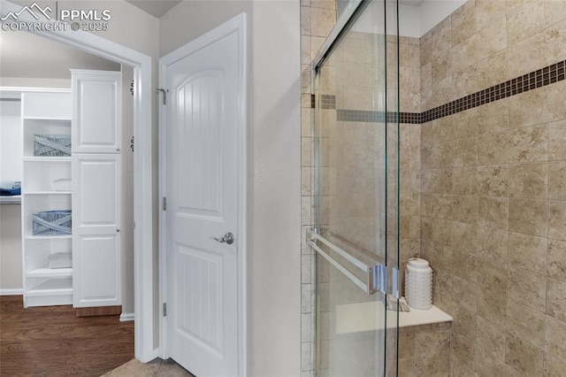 8795 Canary Cir, Colorado Springs, CO 80908 - full bath featuring a shower stall and wood finished floors