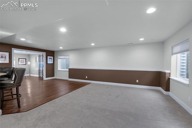 8795 Canary Cir, Colorado Springs, CO 80908 - carpeted living area featuring recessed lighting, baseboards, and wood finished floors