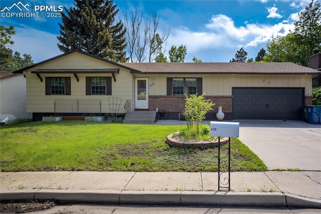 4708 Sprucewood Dr, Colorado Springs, CO 80918 - ranch-style home with an attached garage, a front lawn, driveway, and brick siding