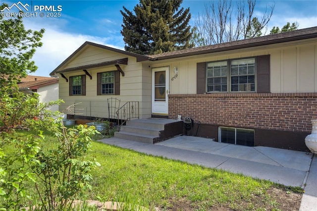 4708 Sprucewood Dr, Colorado Springs, CO 80918 - ranch-style house featuring board and batten siding, brick siding, and a patio