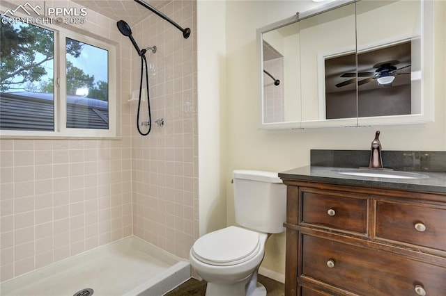 4708 Sprucewood Dr, Colorado Springs, CO 80918 - bathroom featuring toilet, tiled shower, and vanity