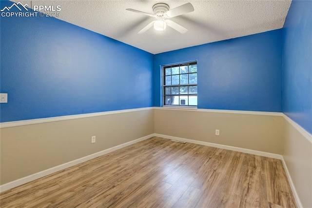 4708 Sprucewood Dr, Colorado Springs, CO 80918 - unfurnished room featuring a textured ceiling, wood finished floors, a ceiling fan, and baseboards