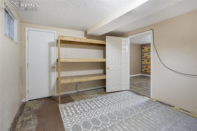 4708 Sprucewood Dr, Colorado Springs, CO 80918 - finished basement with a textured ceiling and baseboards