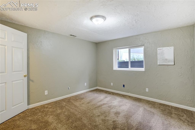 4708 Sprucewood Dr, Colorado Springs, CO 80918 - carpeted spare room with a textured wall, a textured ceiling, and baseboards