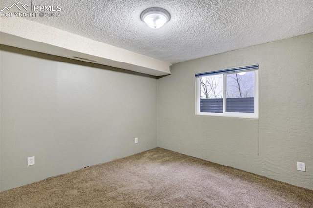 4708 Sprucewood Dr, Colorado Springs, CO 80918 - basement featuring carpet floors, a textured ceiling, and a textured wall