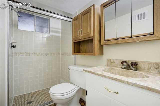 4708 Sprucewood Dr, Colorado Springs, CO 80918 - full bathroom featuring vanity, toilet, and tiled shower