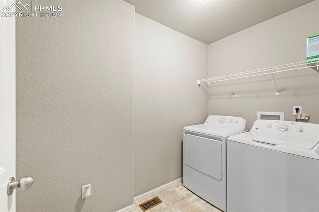 7315 Forest Meadows Ave, Colorado Springs, CO 80908 - laundry area with washing machine and clothes dryer and baseboards