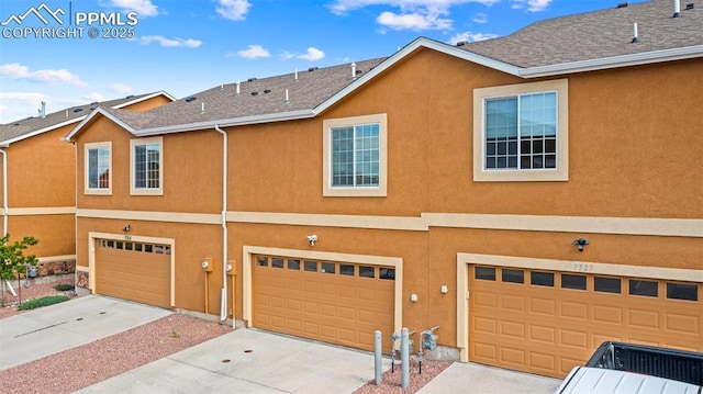 7315 Forest Meadows Ave, Colorado Springs, CO 80908 - view of front of property with a garage, stucco siding, and driveway