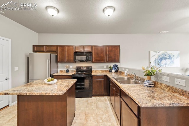 7315 Forest Meadows Ave, Colorado Springs, CO 80908 - kitchen with black appliances, a sink, a kitchen island, a peninsula, and light stone countertops