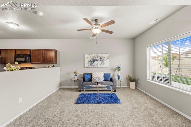 7315 Forest Meadows Ave, Colorado Springs, CO 80908 - sitting room with carpet flooring, ceiling fan, and baseboards