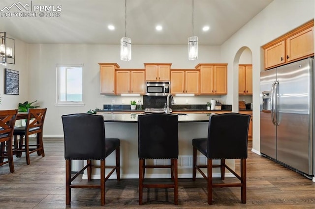 15506 Short Line Ct, Monument, CO 80132 - kitchen with stainless steel appliances, light brown cabinets, dark countertops, dark wood finished floors, and recessed lighting