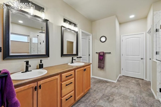 15506 Short Line Ct, Monument, CO 80132 - bathroom with tiled shower, double vanity, and baseboards