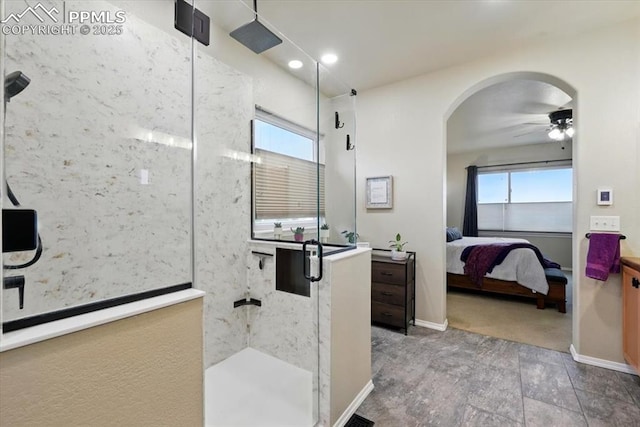 15506 Short Line Ct, Monument, CO 80132 - bathroom with walk in shower, ensuite bath, a ceiling fan, baseboards, and recessed lighting