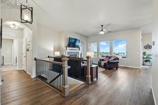 15506 Short Line Ct, Monument, CO 80132 - living area featuring hardwood / wood-style flooring, ceiling fan, and baseboards
