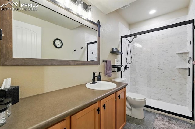 15506 Short Line Ct, Monument, CO 80132 - bathroom featuring vanity, a stall shower, and toilet