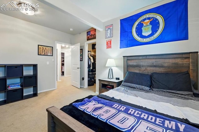 15506 Short Line Ct, Monument, CO 80132 - carpeted bedroom with beamed ceiling, baseboards, a spacious closet, and a closet