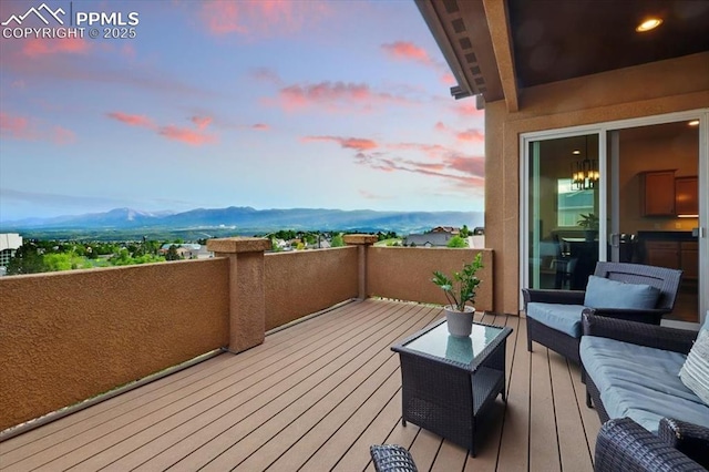 15506 Short Line Ct, Monument, CO 80132 - deck at dusk featuring a mountain view