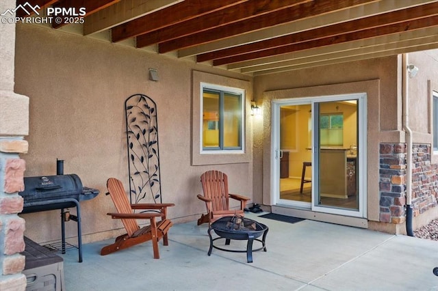 15506 Short Line Ct, Monument, CO 80132 - view of patio with an outdoor fire pit and a grill