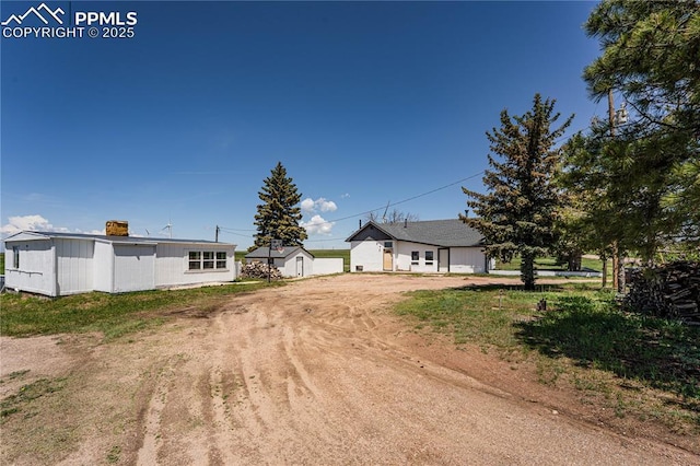 9940 N Calhan Hwy, Calhan, CO 80808 - view of front of property featuring driveway and a chimney