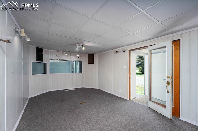 9940 N Calhan Hwy, Calhan, CO 80808 - carpeted spare room featuring wood walls and baseboards