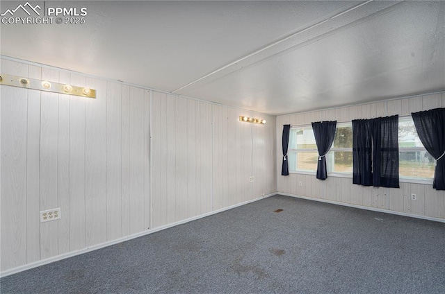 9940 N Calhan Hwy, Calhan, CO 80808 - empty room featuring carpet and wooden walls