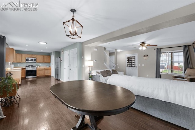 12206 Crystal Downs Rd, Peyton, CO 80831 - dining space featuring stairs, dark wood-style floors, a chandelier, a ceiling fan, and recessed lighting