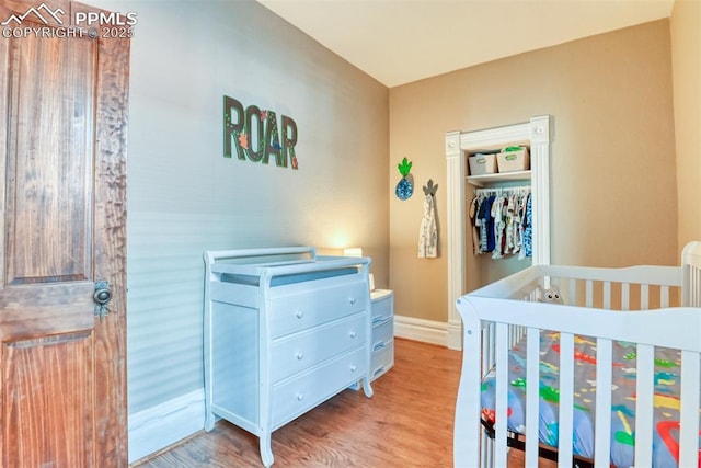 220 E 5th St, Florence, CO 81226 - bedroom featuring wood finished floors, a closet, and baseboards