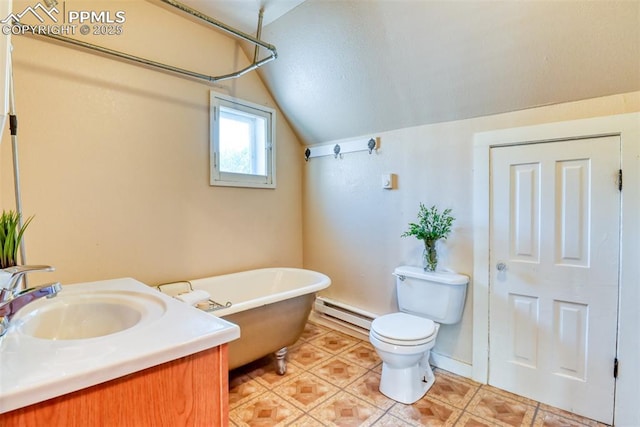 220 E 5th St, Florence, CO 81226 - full bath with a baseboard heating unit, a freestanding bath, vaulted ceiling, vanity, and toilet
