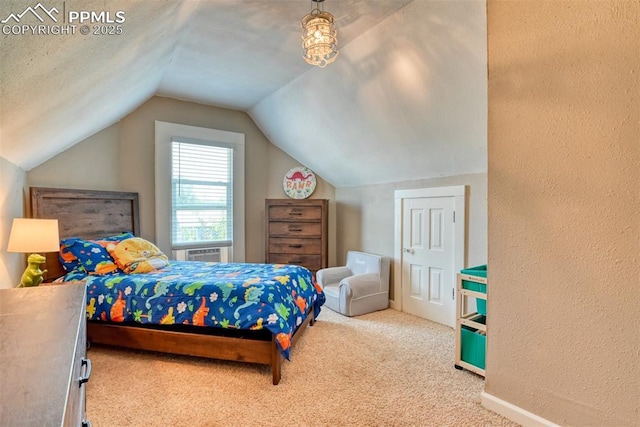 220 E 5th St, Florence, CO 81226 - carpeted bedroom with lofted ceiling and a textured wall