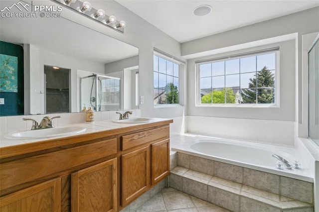 7942 French Rd, Colorado Springs, CO 80920 - bathroom with a bath, a stall shower, double vanity, and tile patterned flooring