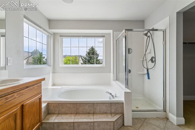 7942 French Rd, Colorado Springs, CO 80920 - full bathroom with a shower stall, a bath, vanity, and tile patterned flooring
