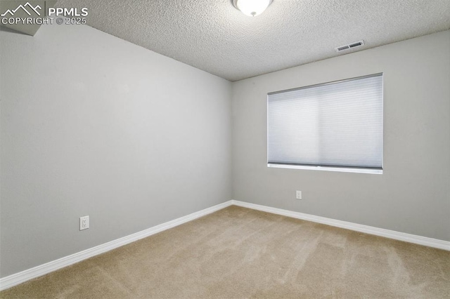 7942 French Rd, Colorado Springs, CO 80920 - unfurnished room featuring carpet, a textured ceiling, and baseboards