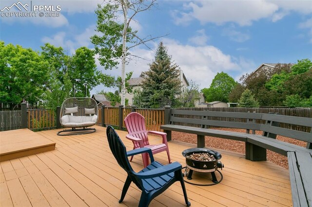 7942 French Rd, Colorado Springs, CO 80920 - deck featuring an outdoor fire pit