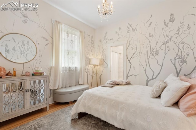 1212 W Cucharras St, Colorado Springs, CO 80904 - bedroom with wood finished floors, a chandelier, and wallpapered walls