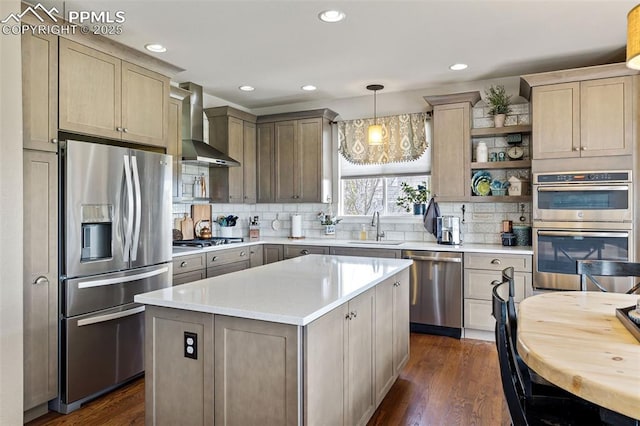 6950 Blue Mesa Ln, Littleton, CO 80125 - kitchen featuring appliances with stainless steel finishes, wall chimney range hood, a sink, dark wood-style floors, and light countertops