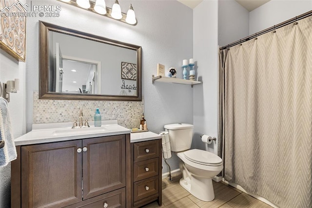 6950 Blue Mesa Ln, Littleton, CO 80125 - full bathroom featuring vanity, toilet, a shower with shower curtain, and wood finished floors