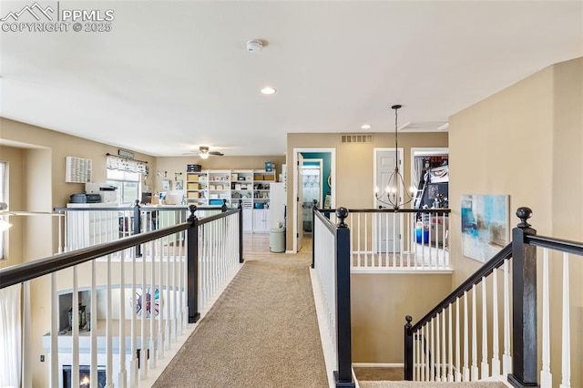 6950 Blue Mesa Ln, Littleton, CO 80125 - hallway with an upstairs landing, a chandelier, recessed lighting, and carpet flooring