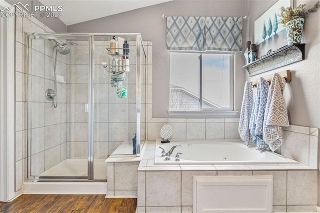 6950 Blue Mesa Ln, Littleton, CO 80125 - bathroom featuring a shower stall, a garden tub, vaulted ceiling, and wood finished floors