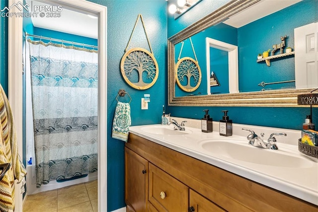 6950 Blue Mesa Ln, Littleton, CO 80125 - full bath featuring tile patterned floors, a textured wall, double vanity, and curtained shower