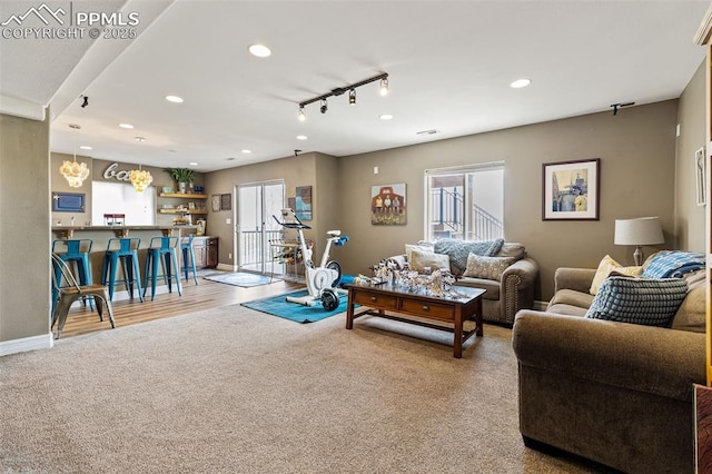 6950 Blue Mesa Ln, Littleton, CO 80125 - carpeted living area featuring recessed lighting, baseboards, and track lighting